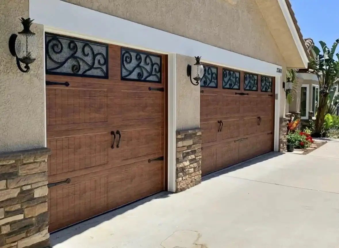 Wood-look carriage-style garage doors with decorative window tops