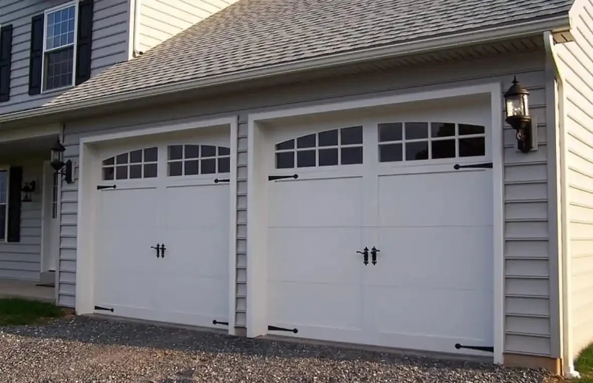 Garage door track and opener hardware inside a garage
